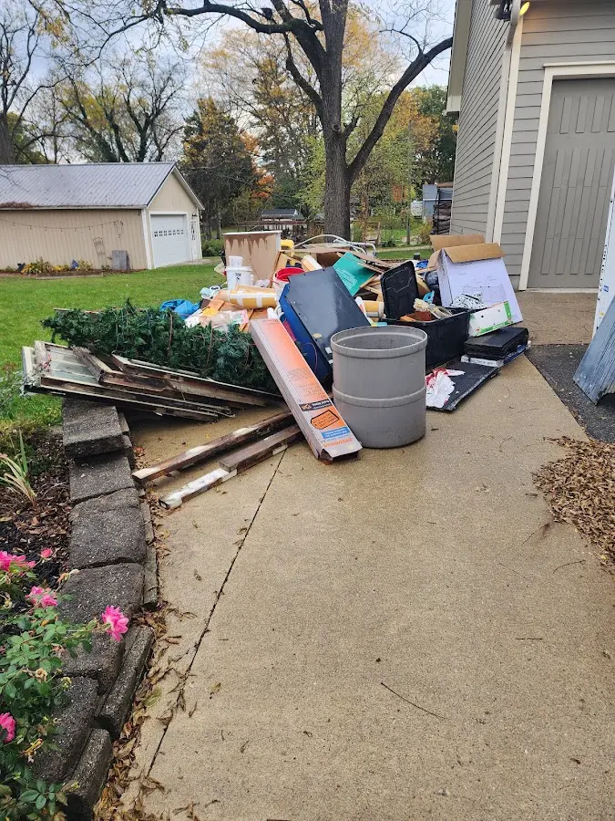 Dumpster being loaded with debris for Commercial Dumpster Rental in Los Banos